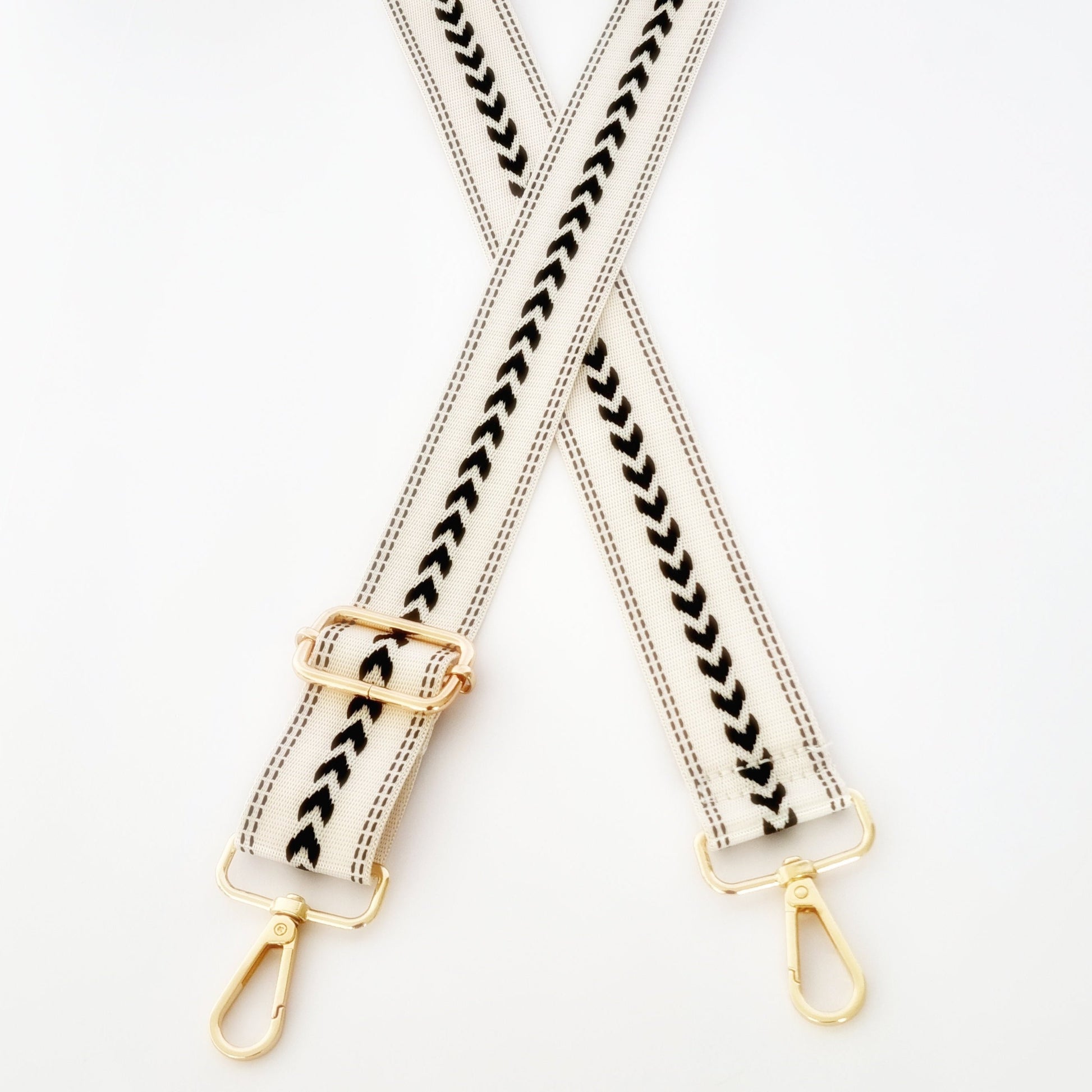 Black and White woven strap with geometric pattern and gold clasp hardware