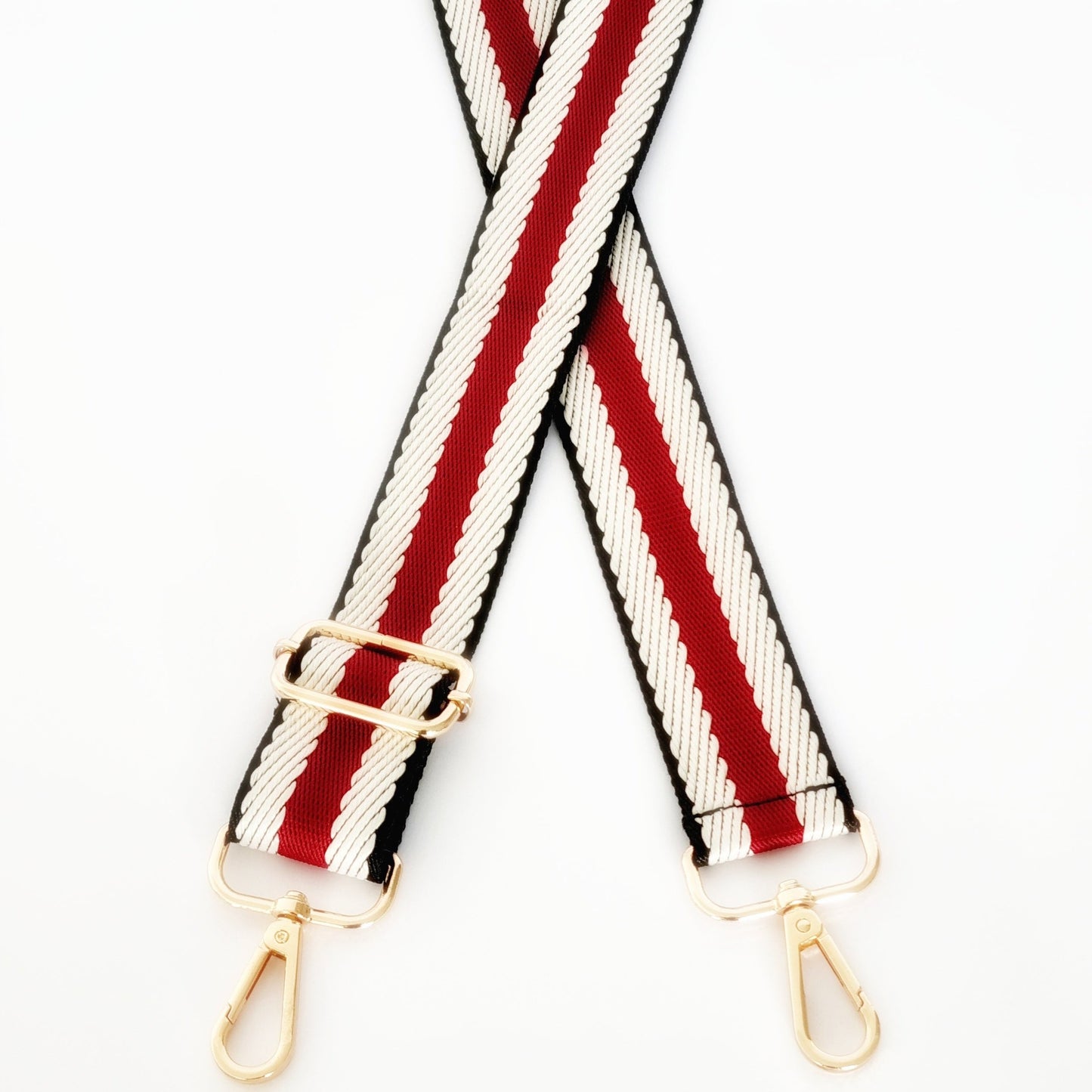 Black, white and red woven strap with gold hardware