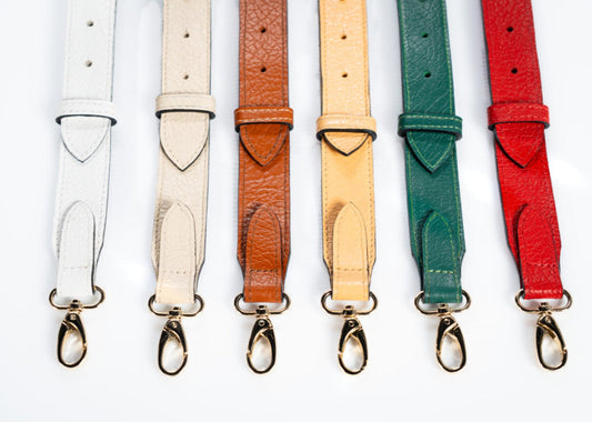 Leather straps in different colors with gold clasp hardware for handbags