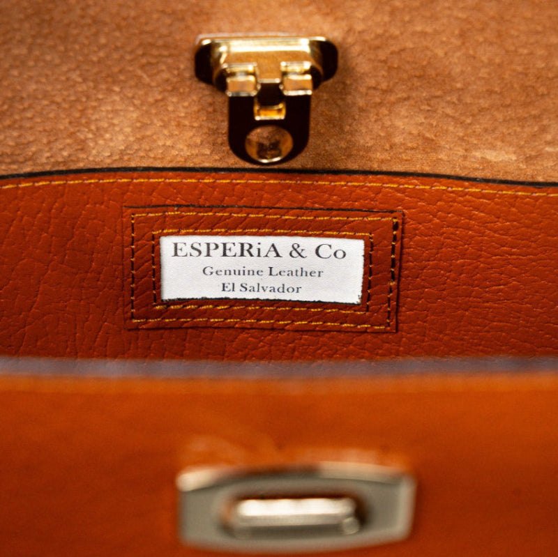 Brown leather bag with gold clasp and Esperia & Co branding